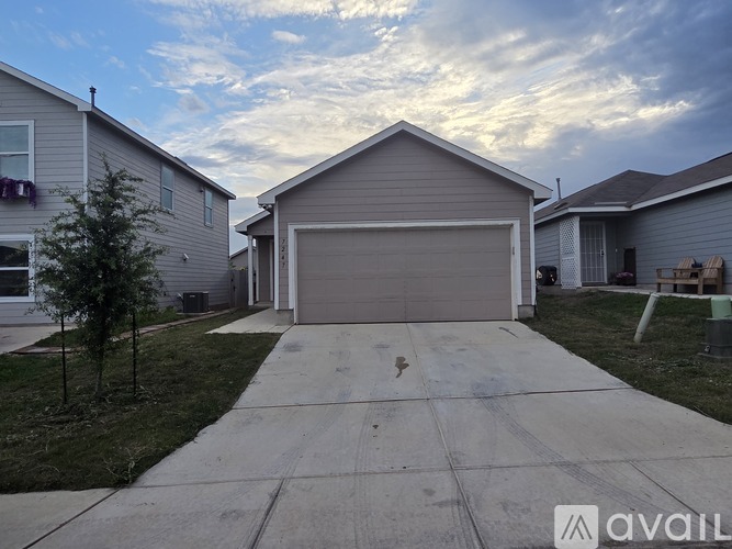A house with a garage is available for sale.