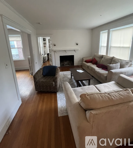 A living room with a fireplace and a couch.