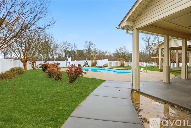 A house with a pool in the backyard.