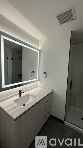 A bathroom with a sink and mirror.