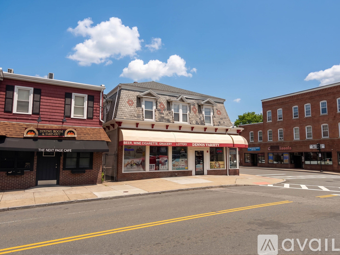 A street view of a town with buildings and a clear sky.