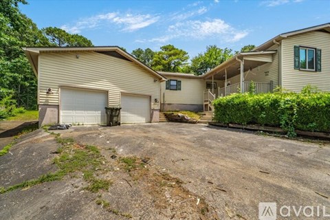 A house with a driveway in front of it is for sale.