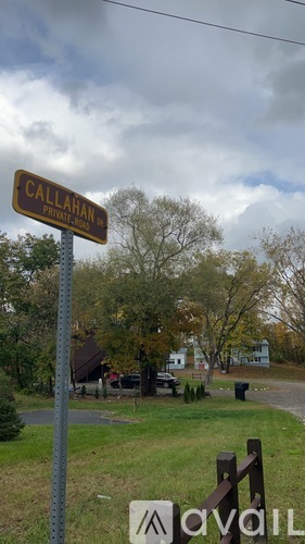 A sign that says "CALLAHAN" is on a pole.