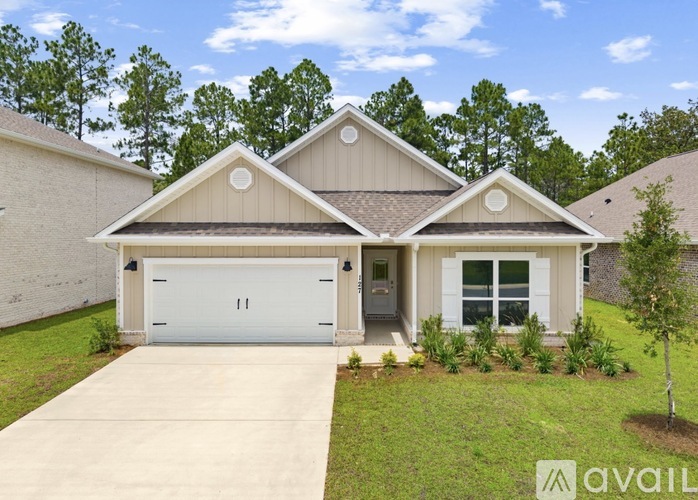 A house with a white garage door is for sale.