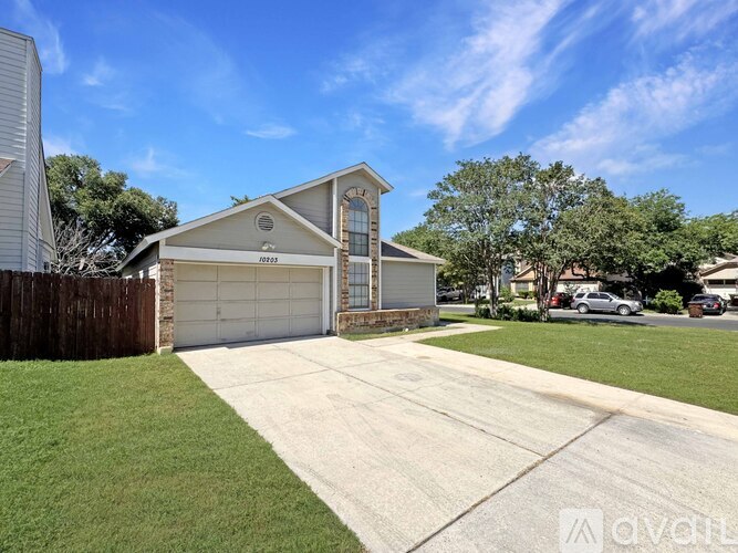 A house with a driveway in front of it.