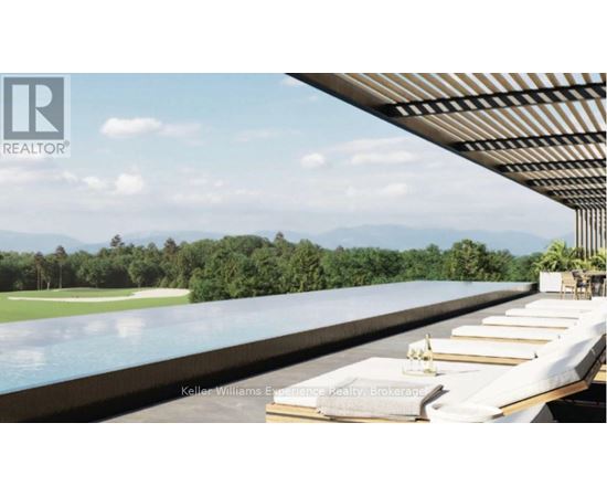 A pool with a view of the mountains and trees.