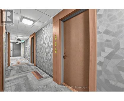 A hallway with a wooden door and a glass door with a number 4 on it.