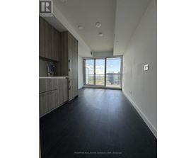 A spacious room with a view of the balcony.
