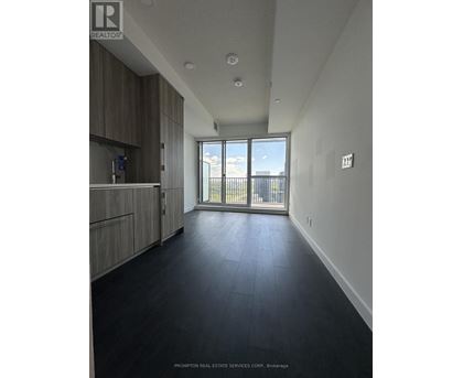 A spacious room with a view of the balcony.