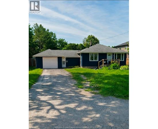 A house with a driveway in front of it.