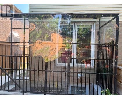 A gate with a painting of a landscape on it.