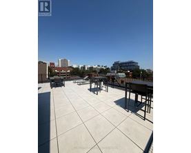 A sunny day at the rooftop with a clear blue sky.
