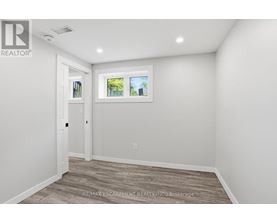 A room with a window and a door.