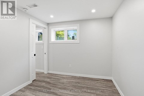 A room with a window and a door.