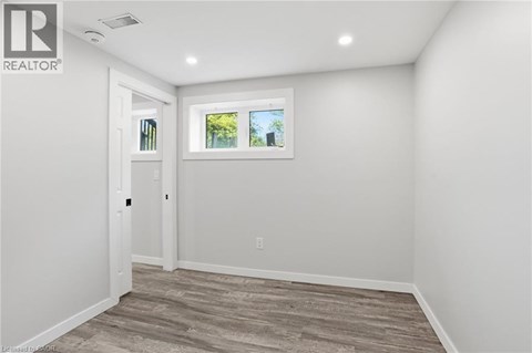 A room with a window and a door.