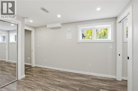 A realtor logo is on the wall of a room.
