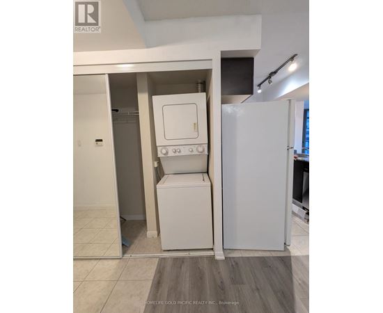 A white oven and fridge in a kitchen.