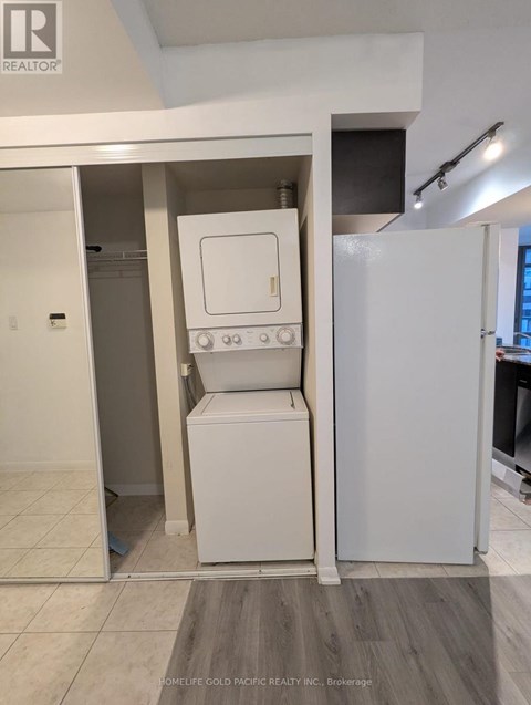 A white oven and fridge in a kitchen.