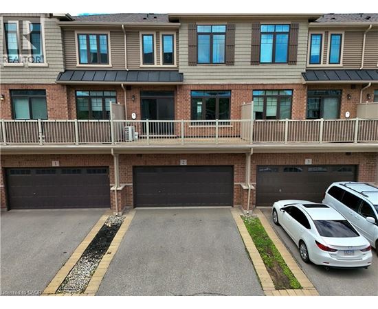 A car is parked in front of a garage door.