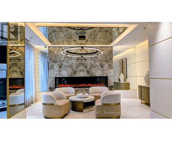 A living room with a fireplace and a large marble wall.