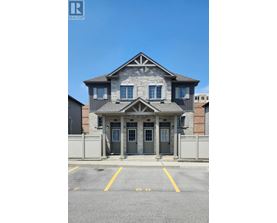 A house with a grey front door and windows.