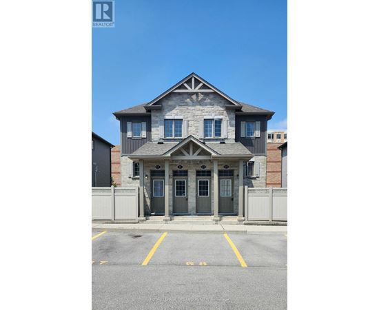 A house with a grey front door and windows.