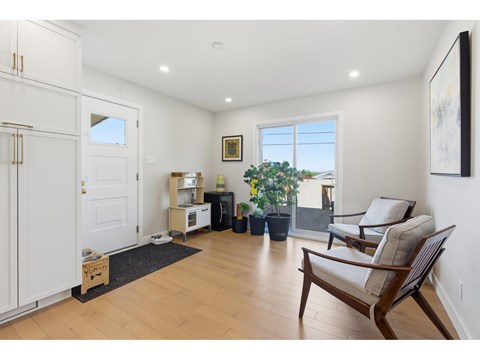 A living room with a chair and a table.
