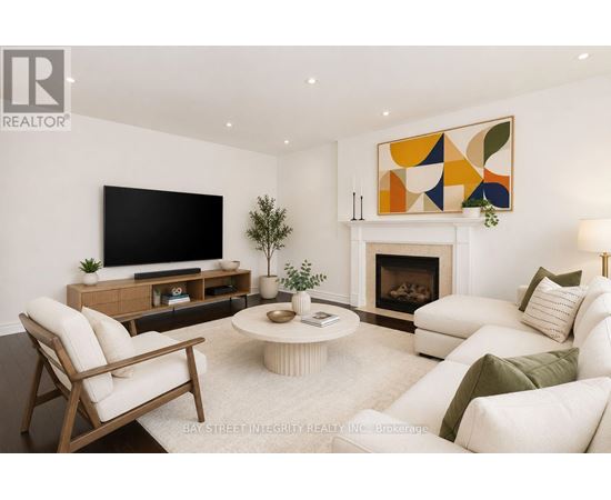 A living room with a fireplace and a television.