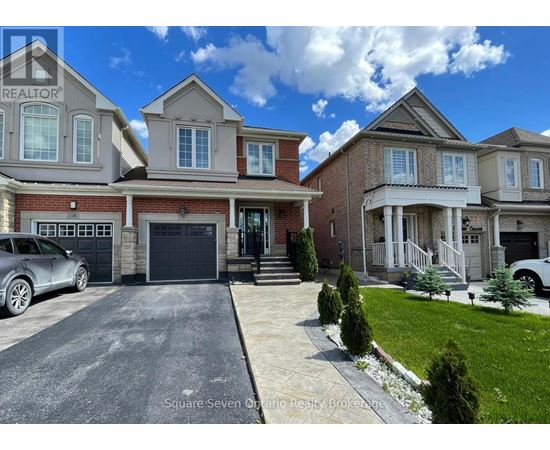 A realtor's photo of a large, multi-level house with a car parked in front.