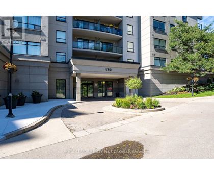 The front of apartment building number 170 with a landscaped area in front.