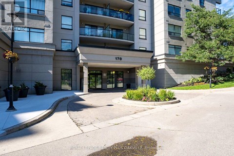 The front of apartment building number 170 with a landscaped area in front.