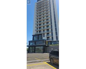 A tall building with a balcony on the side.