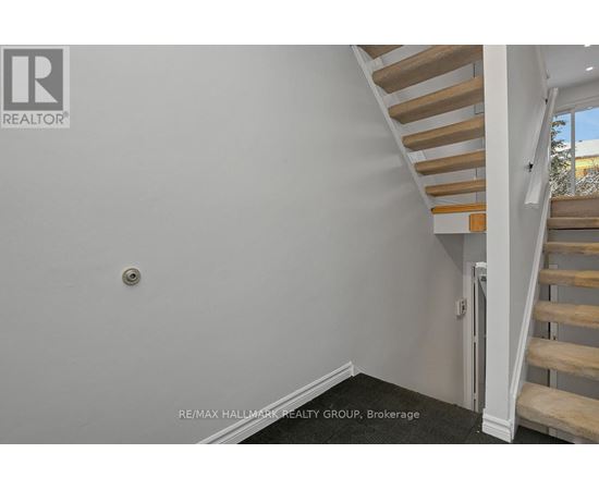 A staircase with wooden steps and white railings.