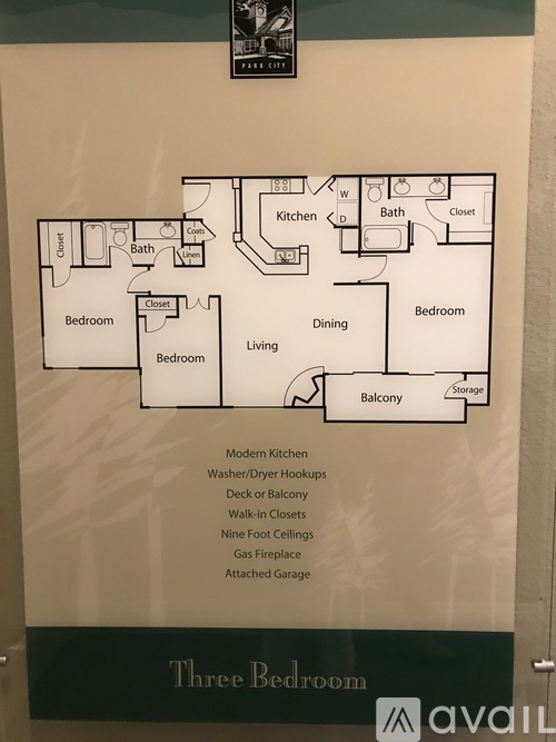 A Three Bedroom house plan is displayed on the wall.