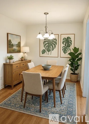 A dining room with a wooden table and chairs.