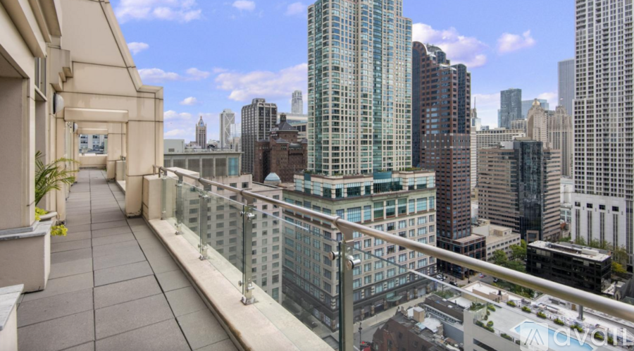 A balcony overlooks a cityscape with tall buildings.