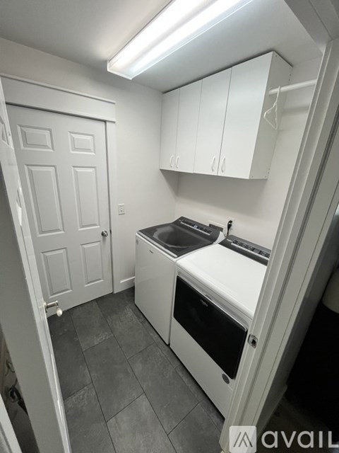 A small kitchen with a sink, stove and oven.