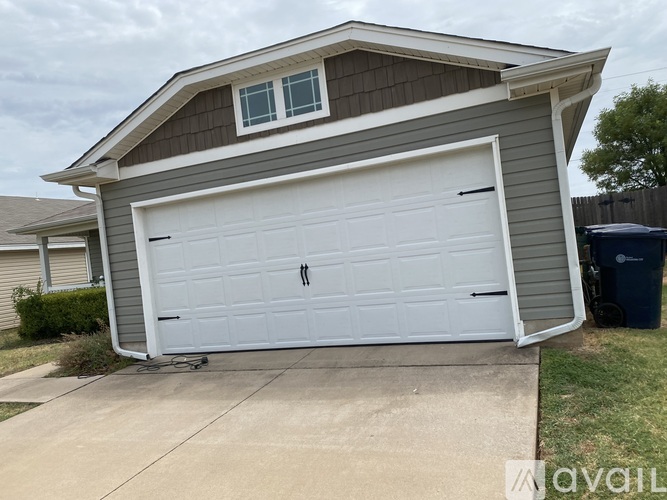 A two-car garage is attached to a house.