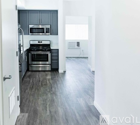 A kitchen with a stove top oven and microwave.