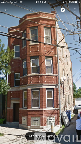 A red brick building with a sign that says 447 N Golden Ave.