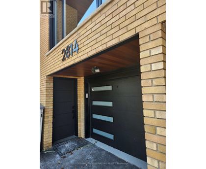 A building entrance with the number 2814 on the wall.