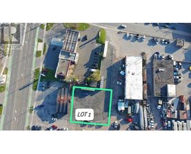 An aerial view of a parking lot with a green square highlighting Lot 1.