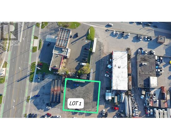 An aerial view of a parking lot with a green square highlighting Lot 1.