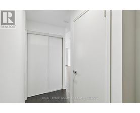 A white door with a glass window is closed.