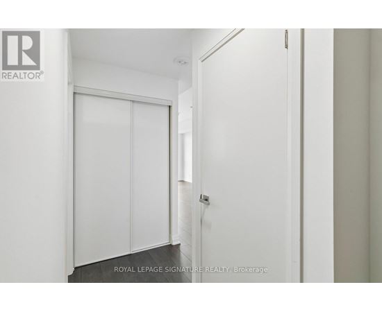 A white door with a glass window is closed.