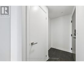 A white door with a handle and a Royal LePage logo on the left side.