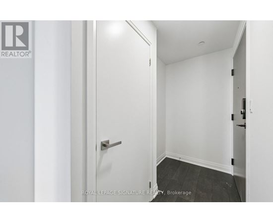 A white door with a handle and a Royal LePage logo on the left side.