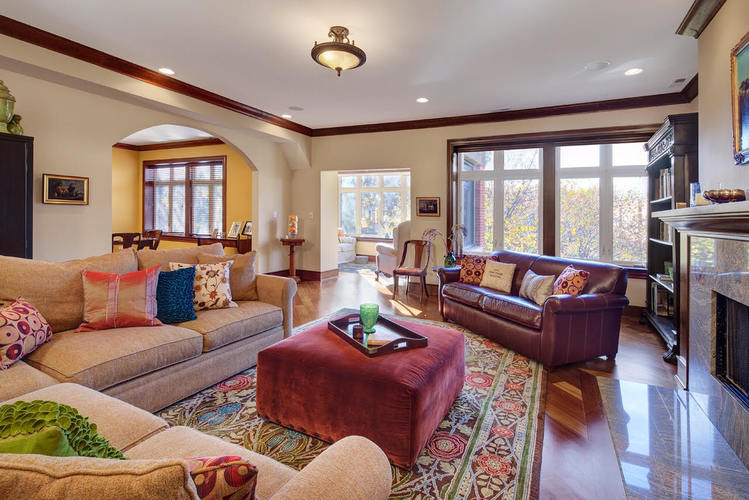 A living room with a couch, a chair, and a coffee table.