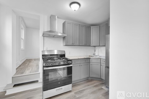 A modern kitchen with a stove and cabinets.
