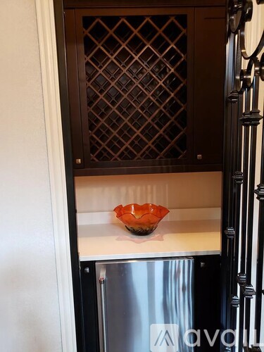A bowl is sitting on a counter in a kitchen.